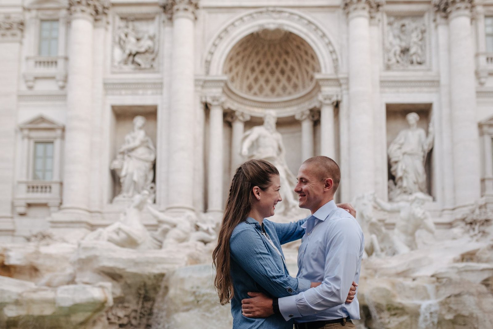 A couple at the Trevi Fountain at dawn