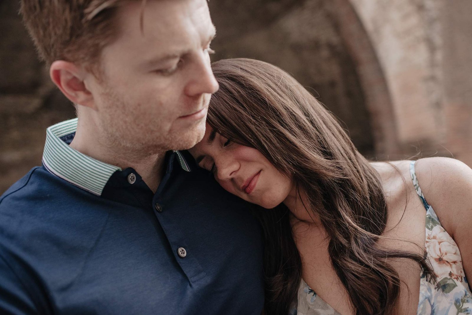 A couple close together, eyes closed