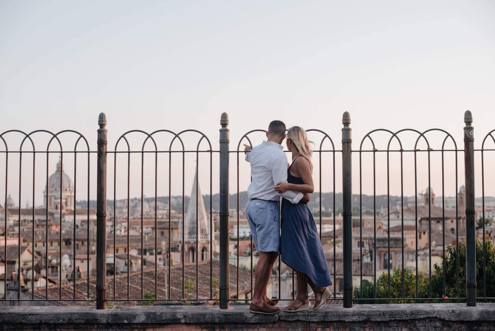 A couple on the terrace with Rome behind