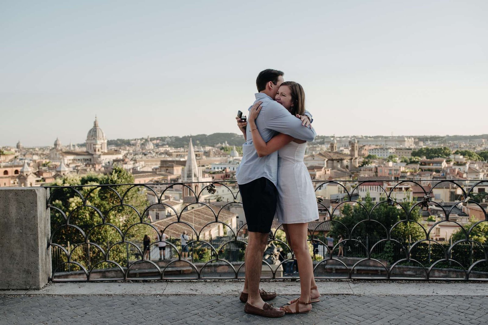 A couple embracing on the terrace over Rome