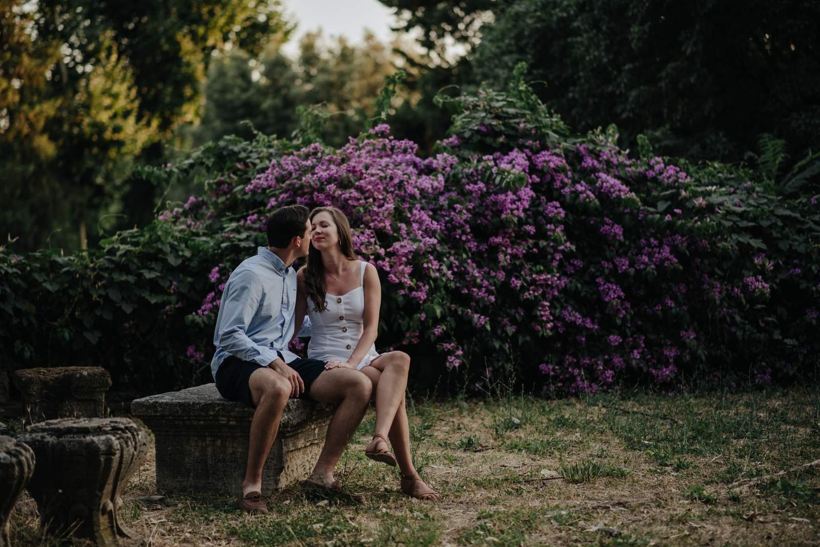 A couple among the flowers in the gardens